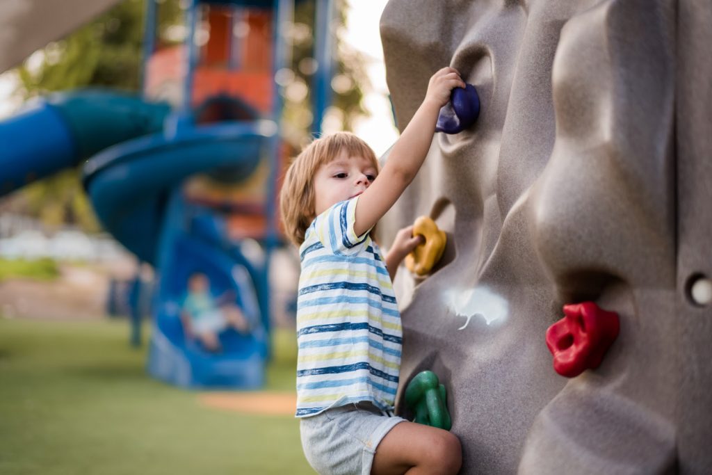 a child rock climbing