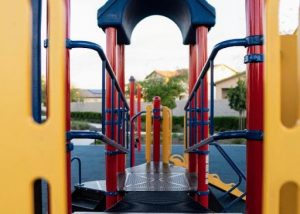 playground equipment that is yellow, blue and red