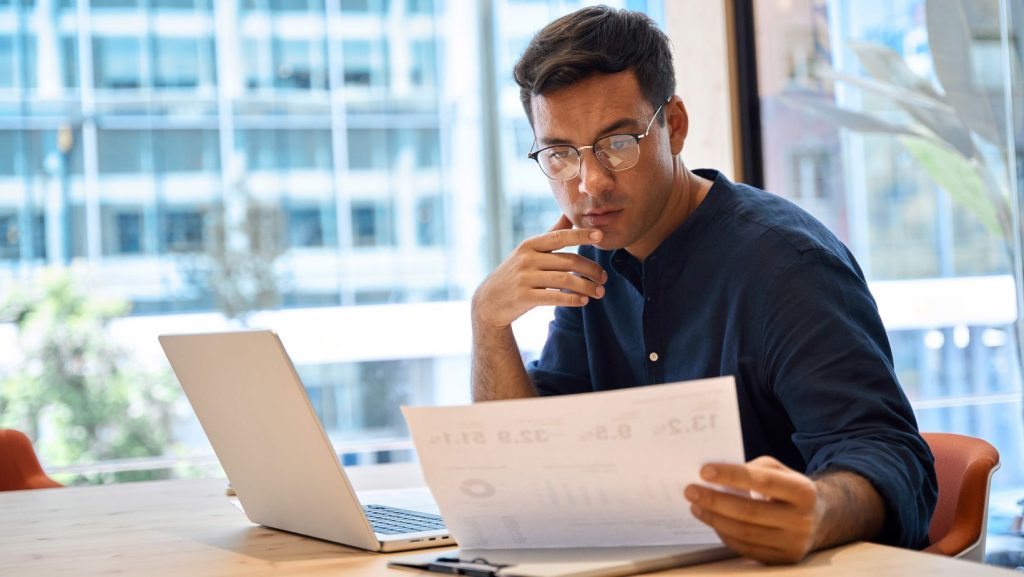Man at desk working on a business plan